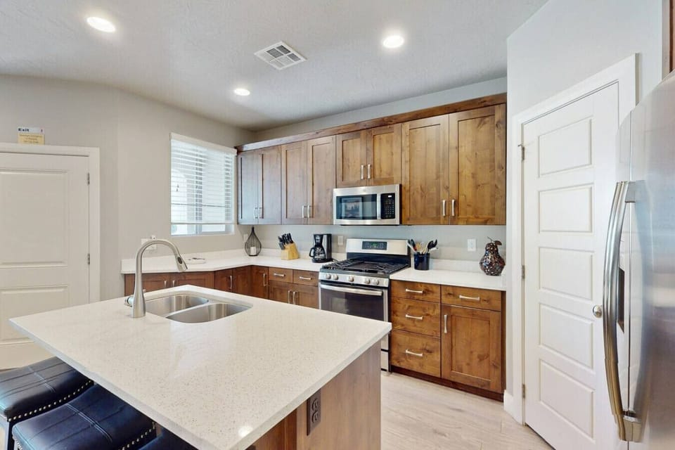 Well Stocked Kitchen with Pantry and Island and 3 barstools