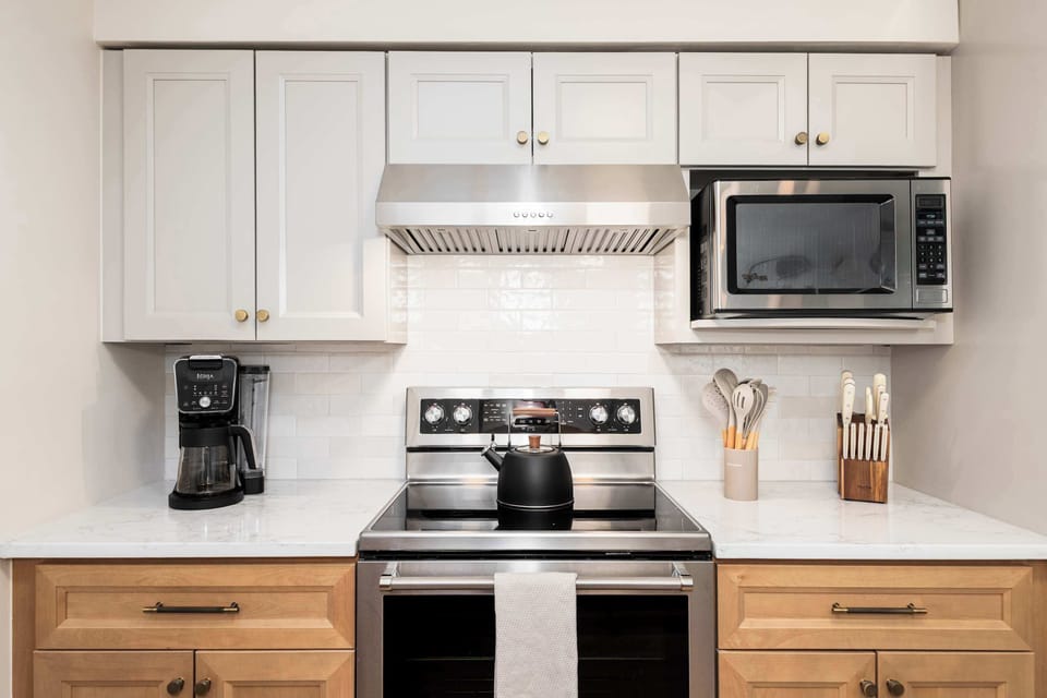 Stocked kitchen with cookware and tools for home-cooked meals.