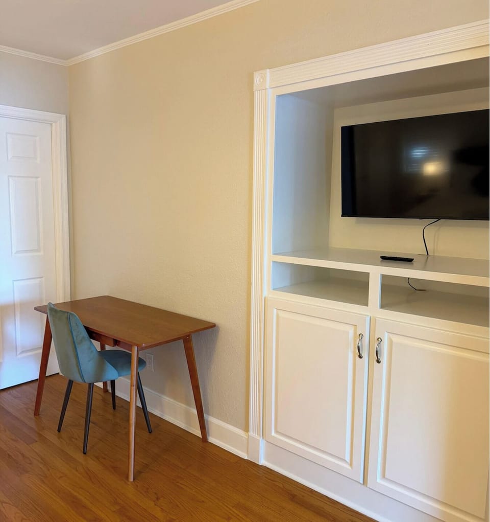 The master bedroom also has a desk and a walk-in closet with a pack n play.