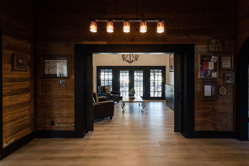 The Beltz House sitting room includes a queen Murphy bed, providing a flexible space for both relaxation and additional sleeping accommodations.