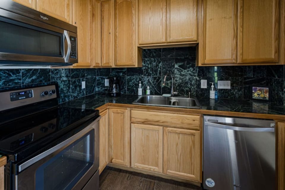 The shared kitchen, conveniently located within the bungalow area, features essential appliances and cooking basics, making it easy to prepare meals during your stay.