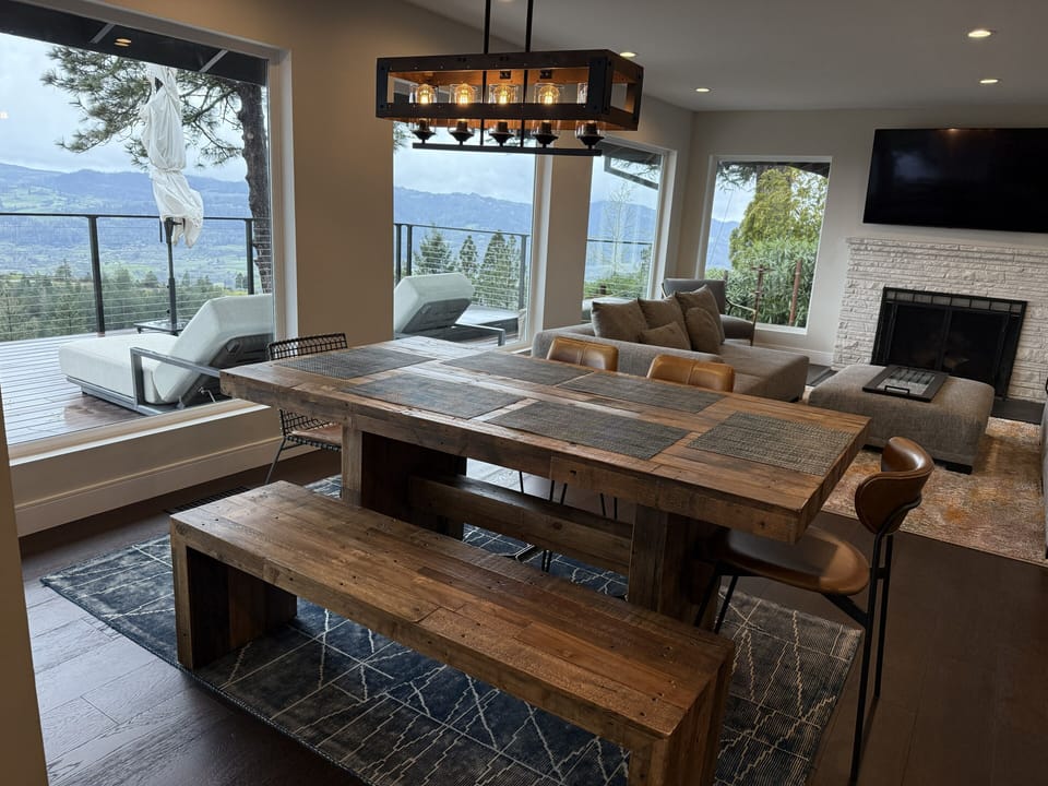 Dining table with 4 chairs and 2-person bench seating.