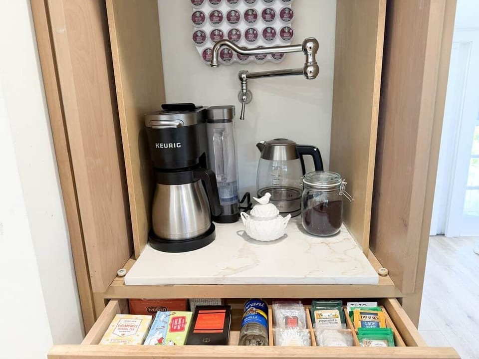 Coffee station with a water source for the coffee reservoir and the tea kettle. Make a cup or a pot!