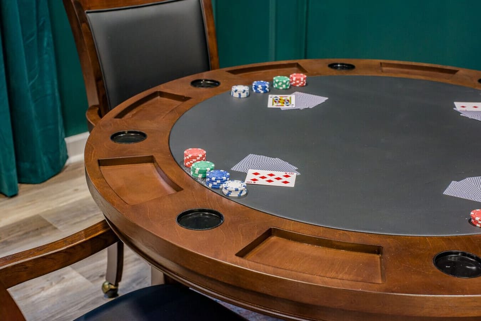Private Gaming Lounge: This dedicated poker nook includes a grand circular table and comfortable seating, providing the ideal atmosphere for friendly competition and late-night fun.