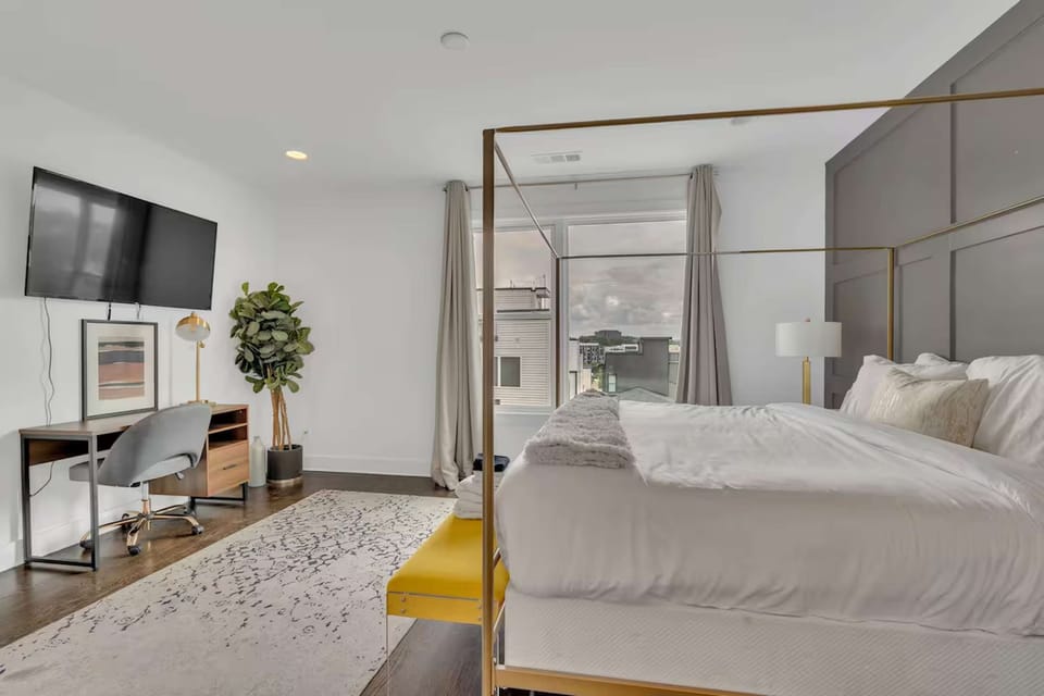 Bedroom 3 w/ king bed, smart TV, desk, walk-in closet, and en-suite bath | Unit B