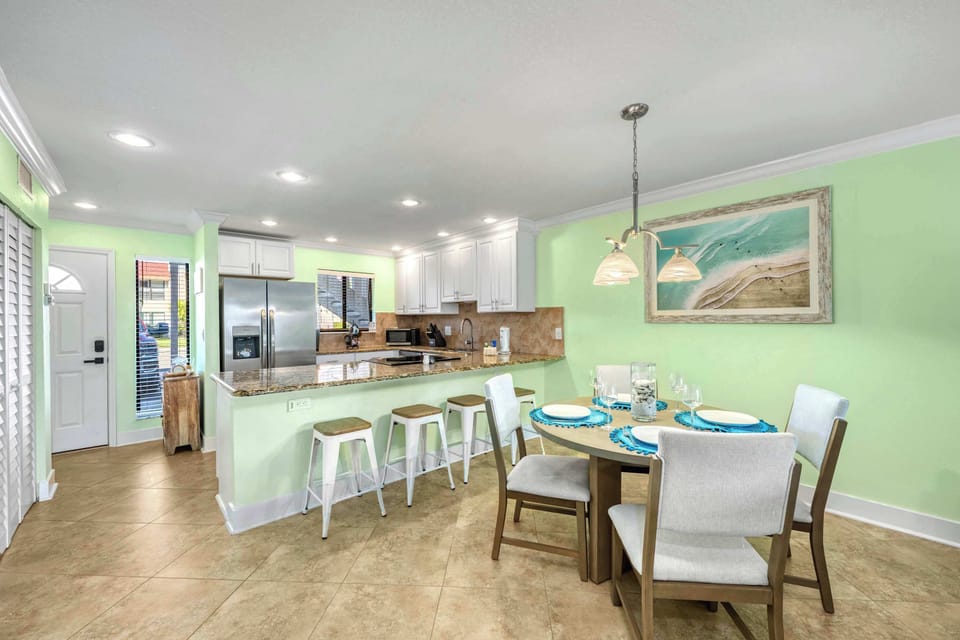 Lovely dining room table and breakfast bar grub stop between beach and pool hopping.