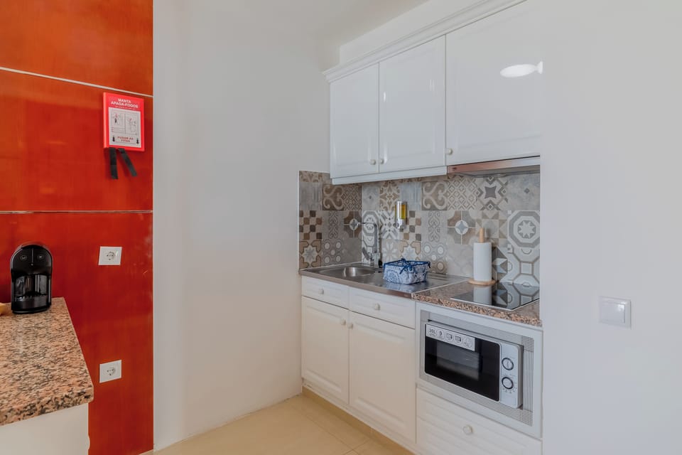 Cook light bites with an easy, well-equipped kitchenette setup.