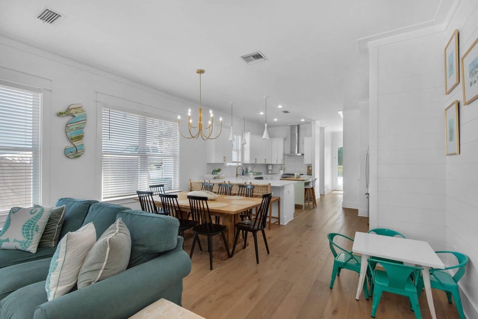 Spacious open-concept space with seating for 8 at the table, 4 at the bar, and even a kids’ table for 4!