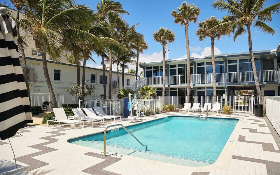 Cool off in the sunny courtyard pool after beach time.