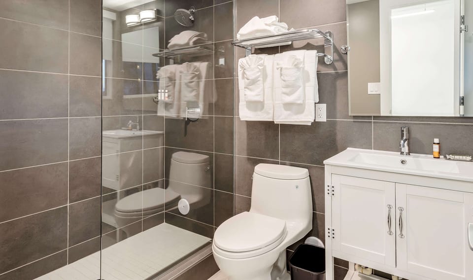 Indulge in a spa-like bath with modern glass shower.