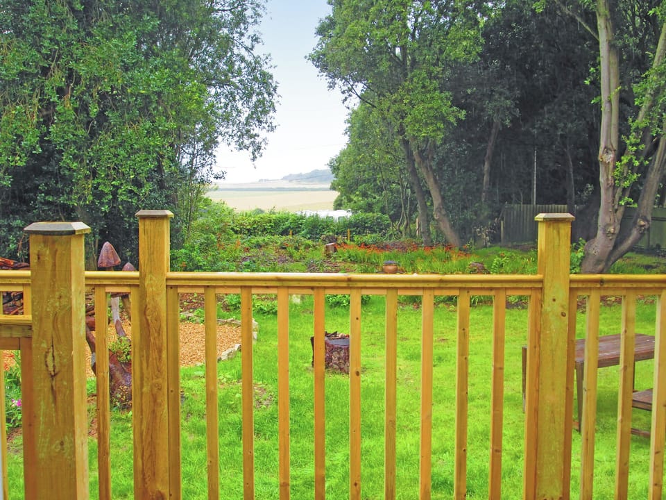 Private garden looking towards the Needles | The Old Kitchens, TOTLAND BAY