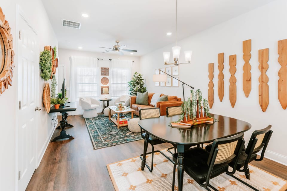 Unwind in a sunlit boho living and dining area with warm textures.