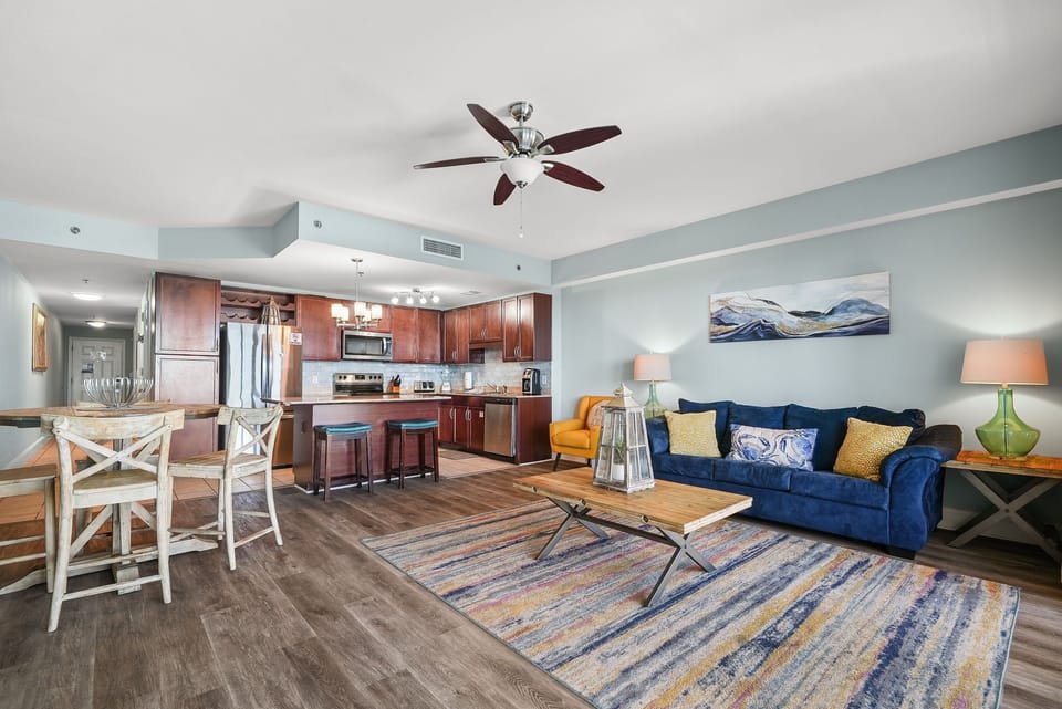 Open-concept living area with modern kitchen and comfortable seating.