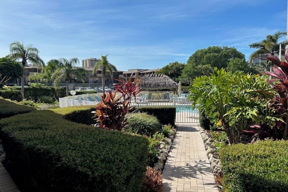 Pool area never crowded (only 15 units), heated, Tiki Hut, Chairs, Tables, Grill