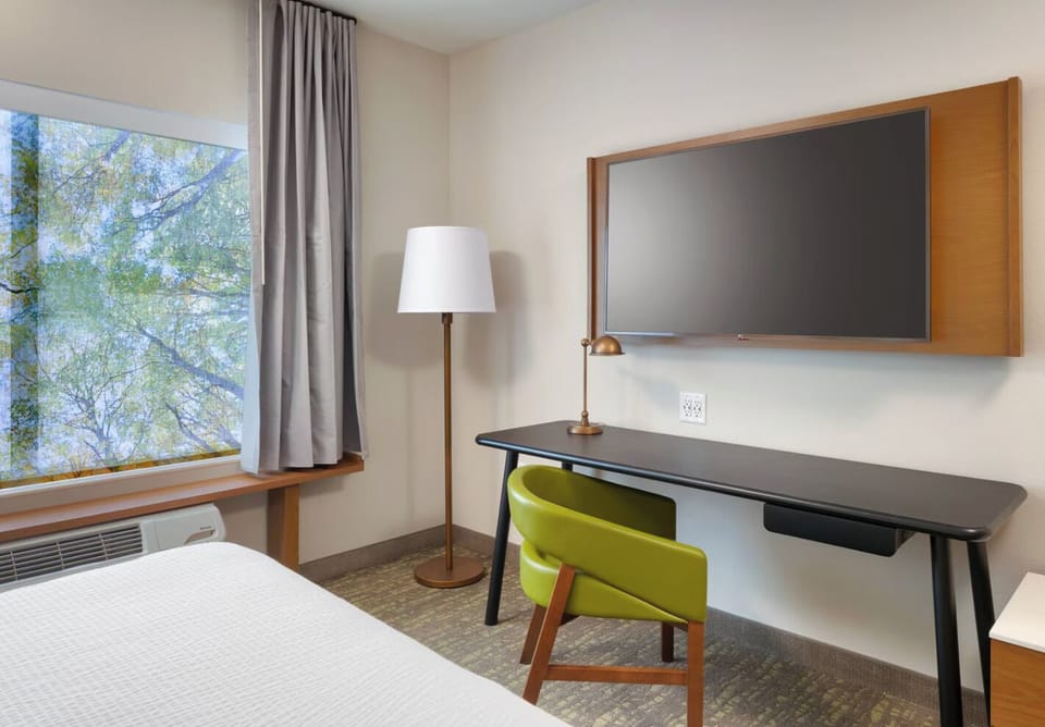 Enjoy a quiet work nook beside the sunny window view.