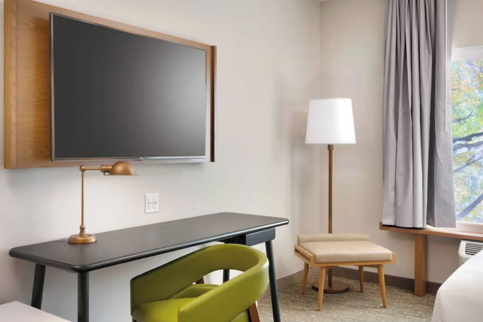Settle in at the sleek desk for focused work time.