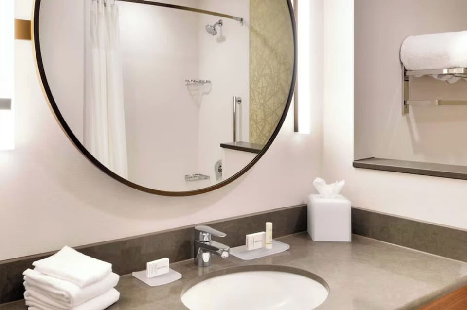 Pamper yourself at the spacious vanity with glowing mirror light.