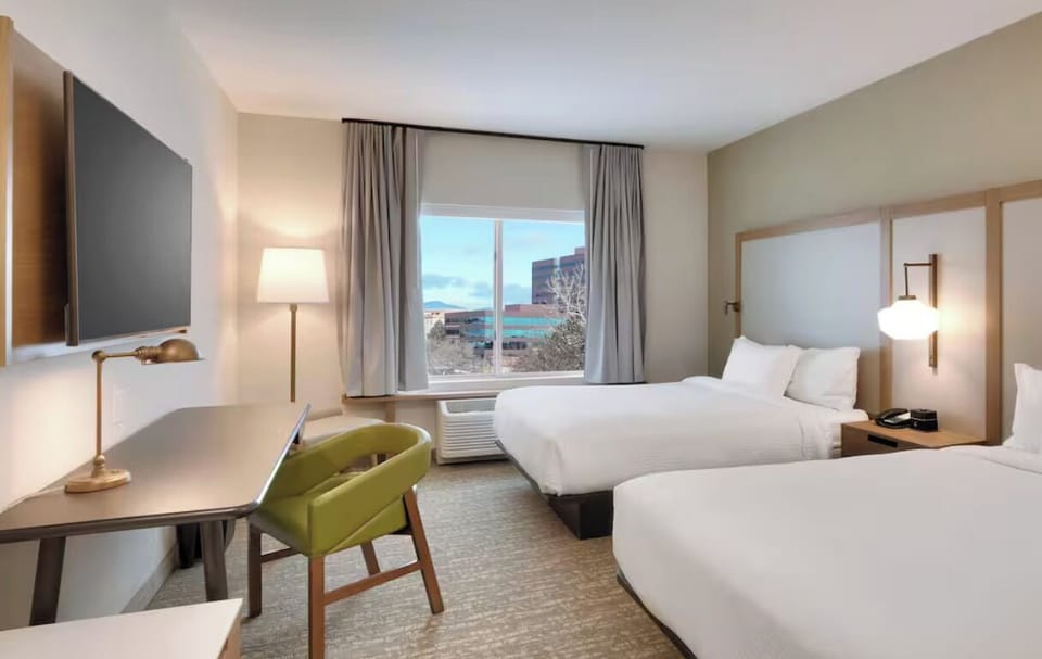 Unwind in a bright double-queen room with city views.
