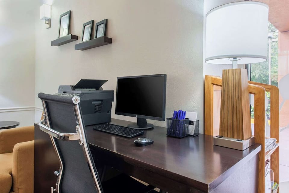 Settle in and stay productive at this well-lit work desk.