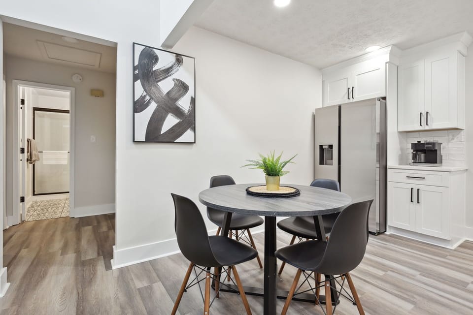 A four-seater dining table quick access to kitchen