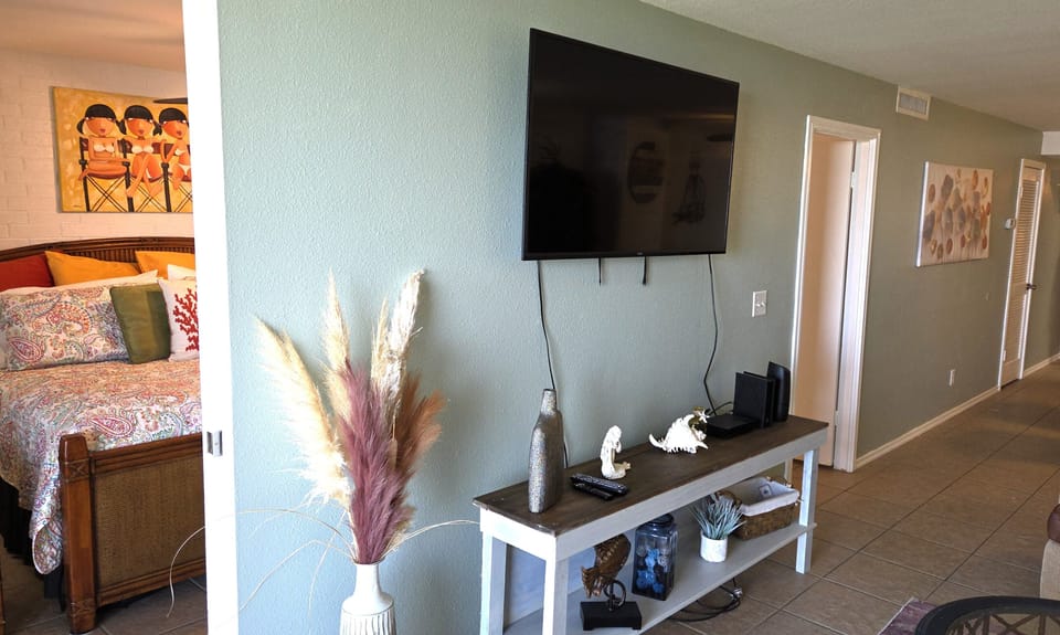 The primary suite is off the living area and has a sliding pocket door