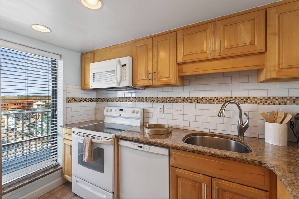 A bright, fully equipped kitchen where preparing meals feels effortless and enjoyable.