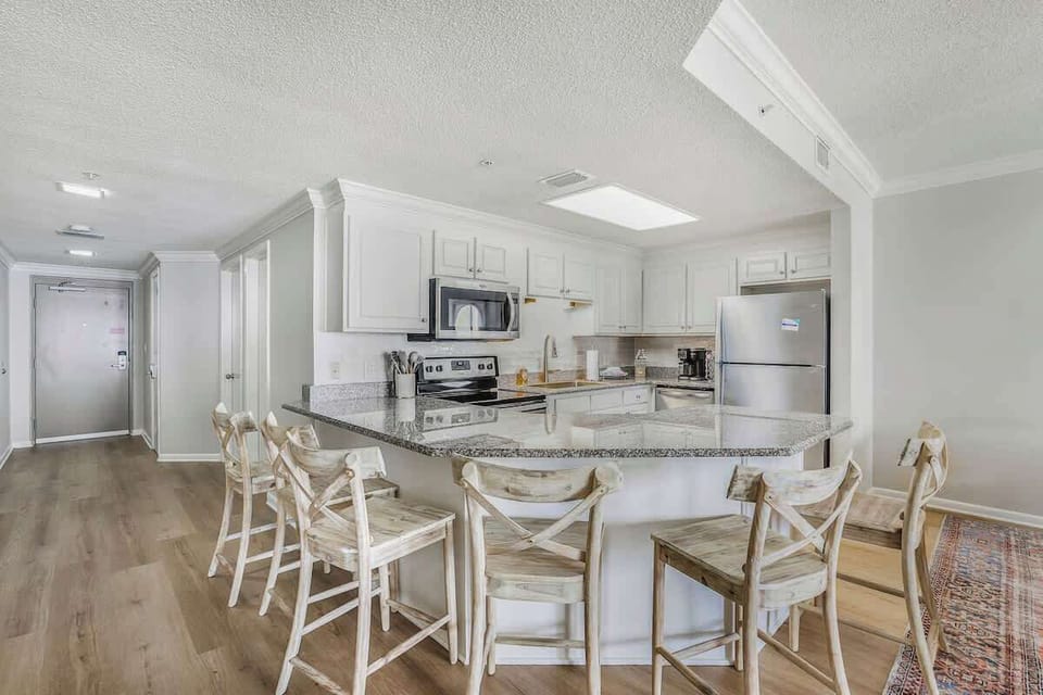 Fully equipped kitchen with bar seating