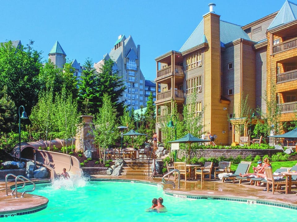 Heated pool with slide