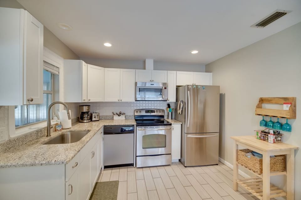 Full kitchen, BBQ tools, blender, coffee maker, dishes, toaster, washer & dryer.