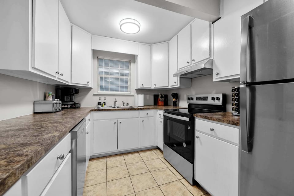 Fully stocked with a Keurig coffee station and dishwasher to streamline your daily routine.