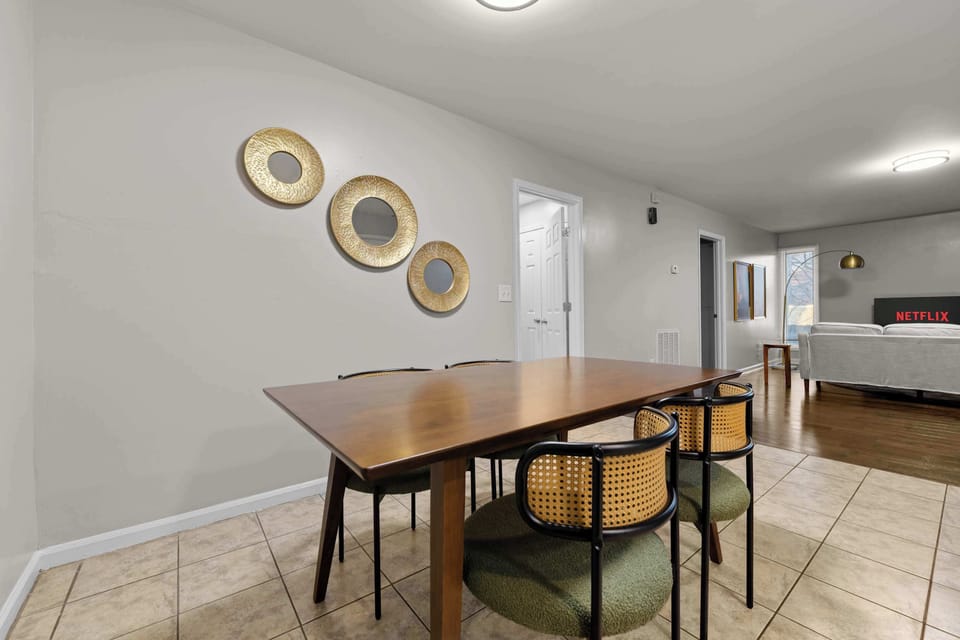 This elegant wooden dining set provides a stylish spot for meals or serves as a dedicated workspace.