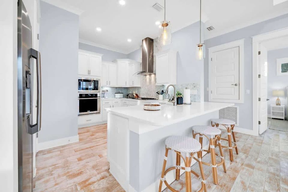 Enjoy meals in the gourmet kitchen & additional island seating for 3.