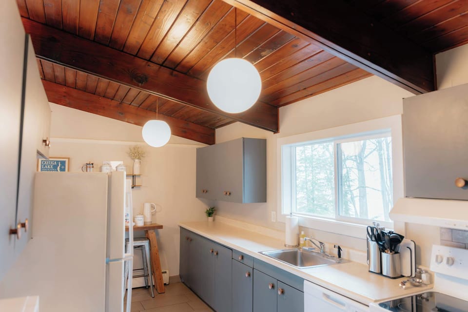 Fully equipped kitchen with ample counter space and everything you need for meals during your stay.