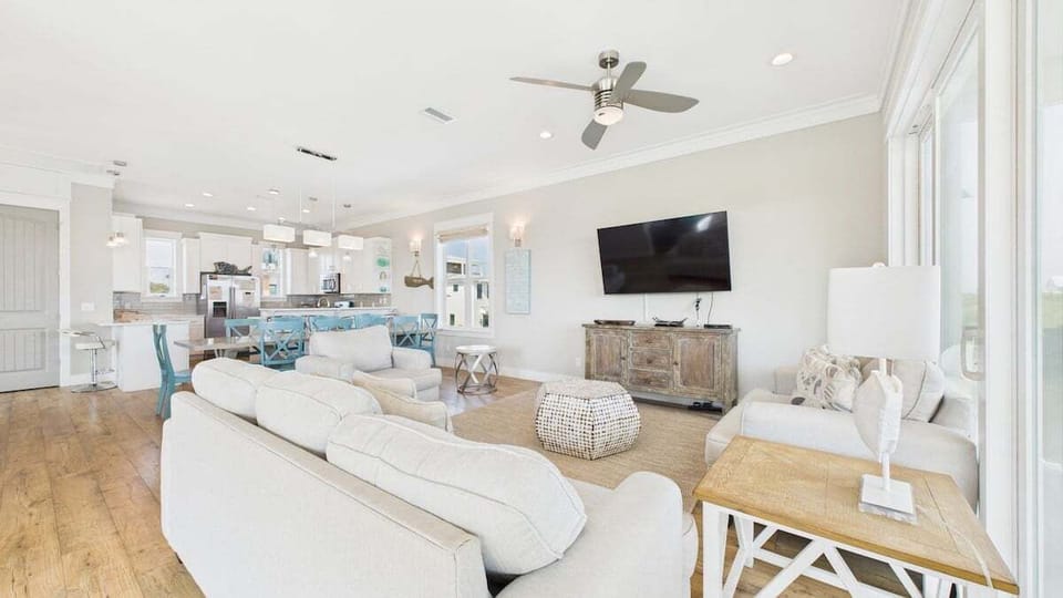 Third floor - Open concept living area with stylish furnishings sleeper sofa and TV