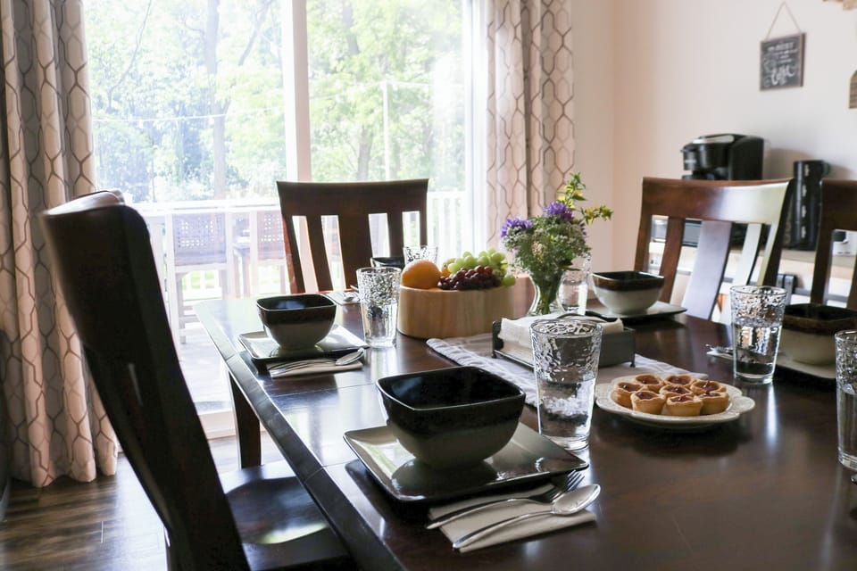 Dining table: seating six with extra folding chairs available.