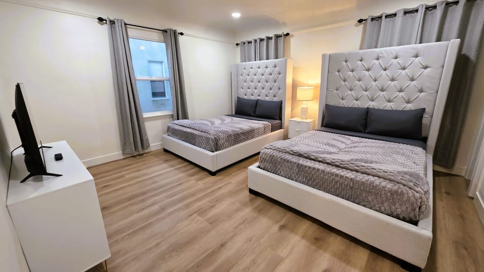 2ND BEDROOM: TWO FULLS (SLEEPS 4) WITH SMART TV, DRESSER AND CLOSET