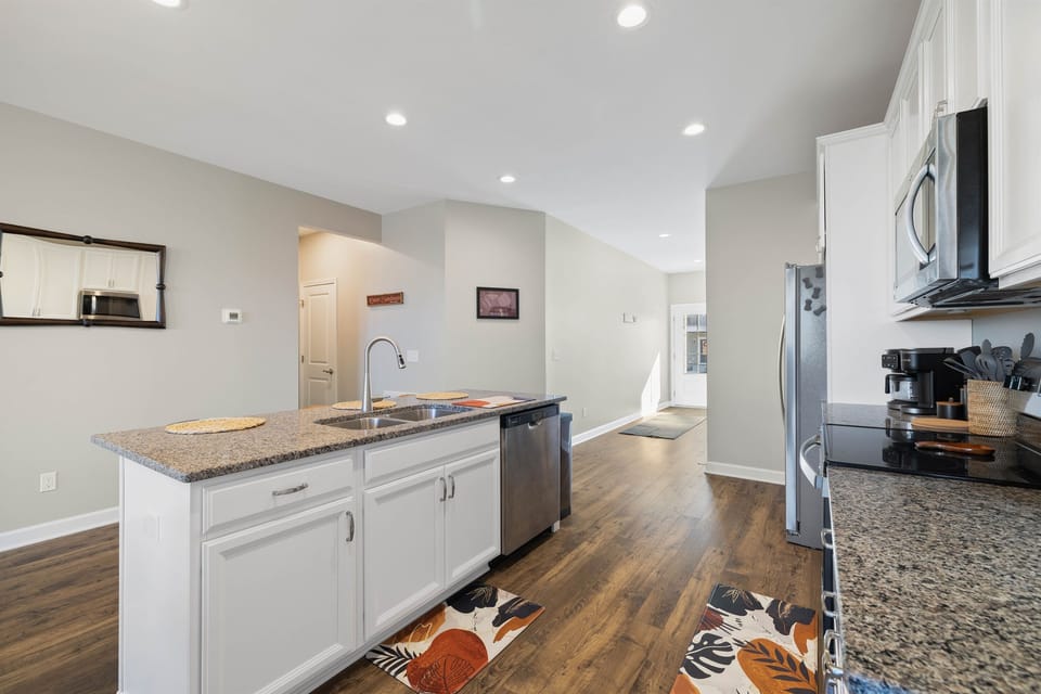 Wide kitchen layout with ample prep and serving space