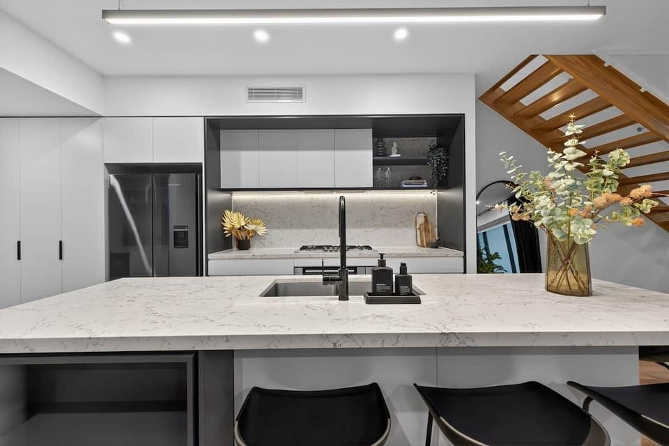 Large kitchen with seating for 4 at the bench, double door fridge and freezer, oven, dishwasher, microwave, coffee machine and wine fridge!
