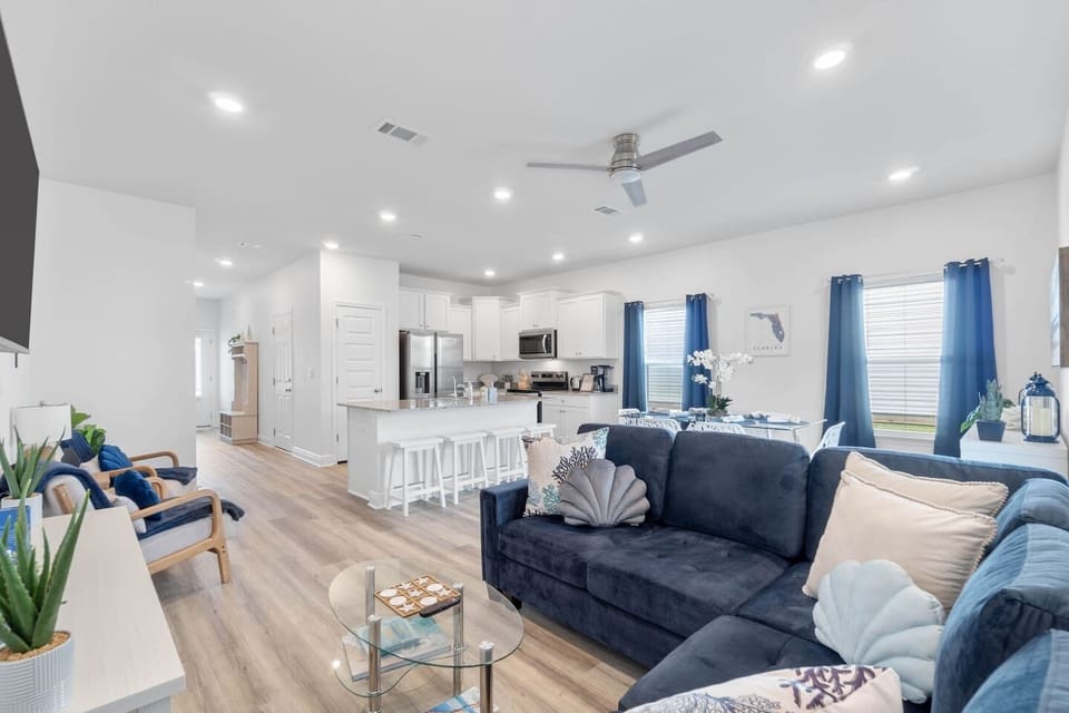Open and Modern: Enjoy the seamless flow of living and kitchen areas, ample light, and a spacious feel. Perfect for cooking, relaxing, or entertaining with 55" RokuTV, hand selected bestseller and coffee table books, and some board games for everyone