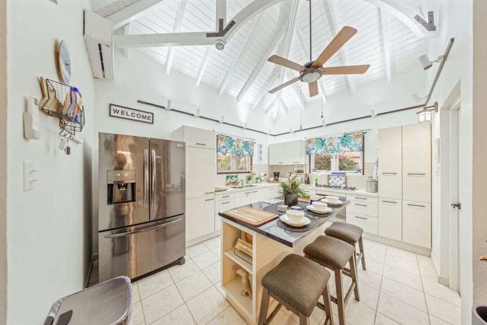 Cook with joy! This fully equipped kitchen features modern appliances, a spacious island for prep, and everything you need to whip up delicious meals during your stay.