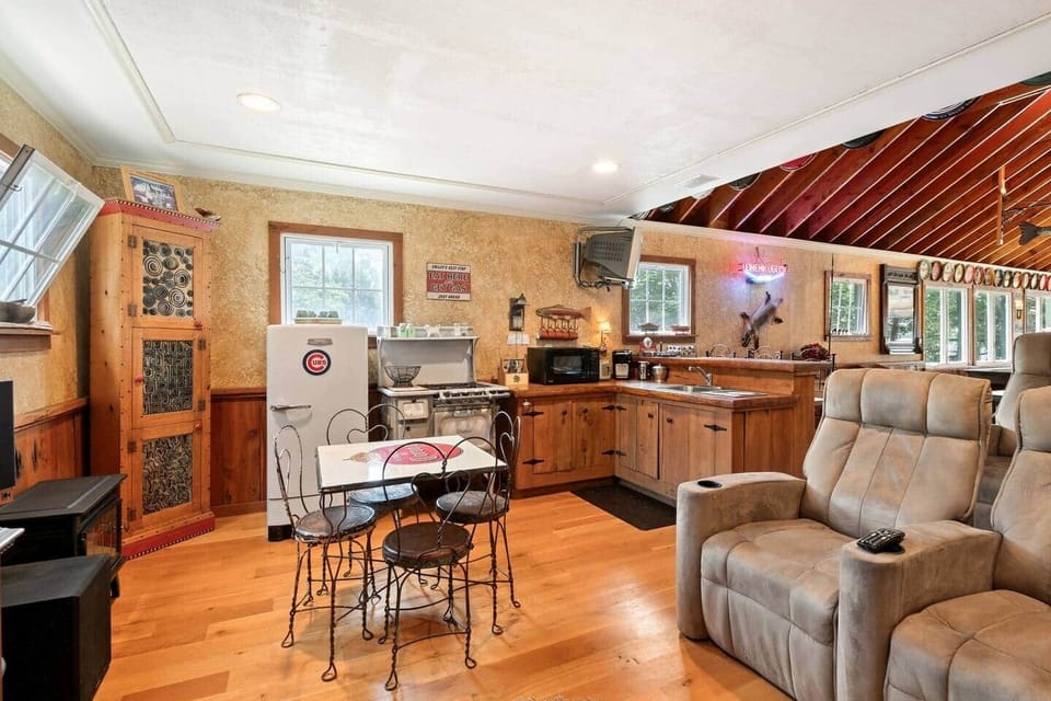 Spacious entertainment lounge with theater seating, vaulted ceilings, and plenty of room to relax or gather with friends and family