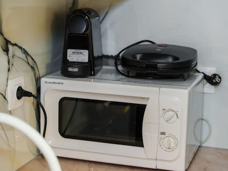 Microwave, coffee maker, and essentials for daily use
