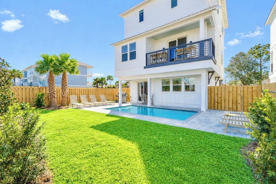 SoCo—your perfect group getaway that SLEEPS 22! Just steps from the beach, this stunning retreat includes a FREE golf cart. Unwind in the backyard oasis with a HEATED pool, outdoor kitchen, and lounge seating.