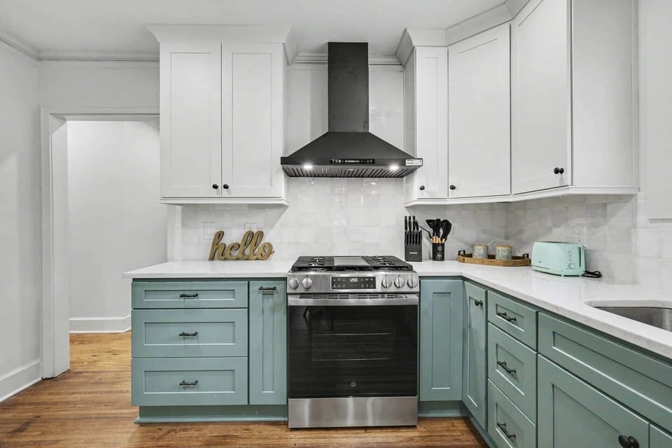 Fully equipped kitchen with gas stove and modern, curated details
