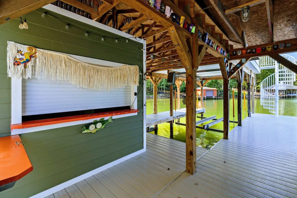 Boathouse Bar - Covered lower level features a tiki-style bar area perfect for lakeside entertaining.