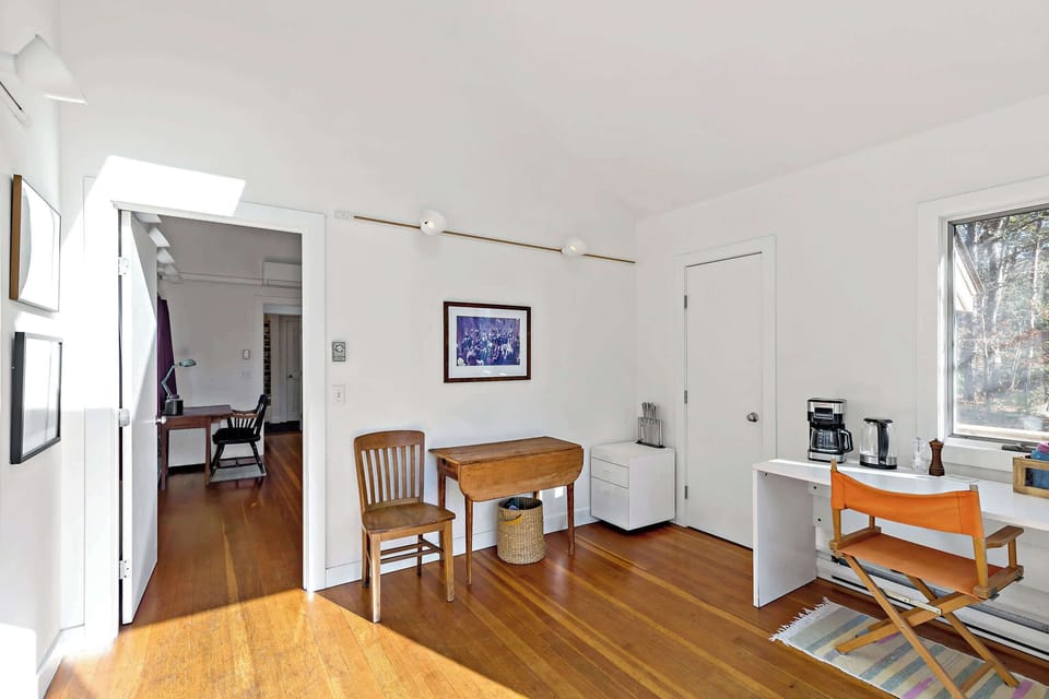 Guest house entry living room with welcoming seating, a comfortable landing spot for the separate suite.