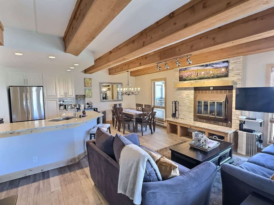 【Dining Table】 Seats 6 with the kitchen two steps away — plate up without running food across the condo.