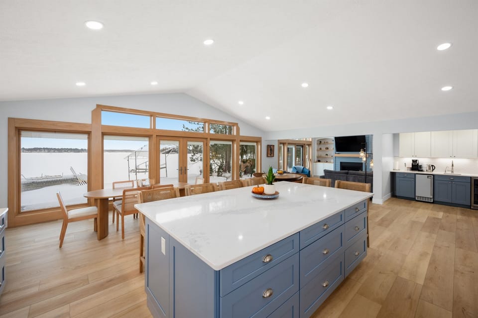 Open-concept kitchen and dining space overlooking the water