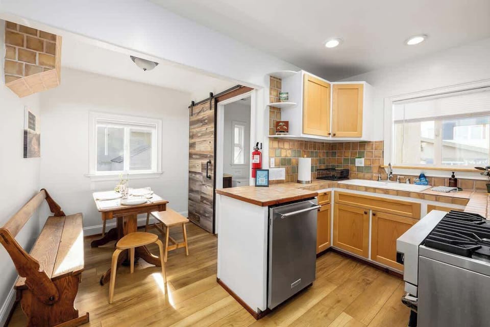 Enjoy the blend of rustic wood elements and modern appliances, perfect for a quiet morning coffee or a home-cooked meal.