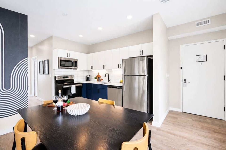 Fully equipped kitchen stocked with your basic cooking essentials, stainless steel appliances, and a dining table for 4.